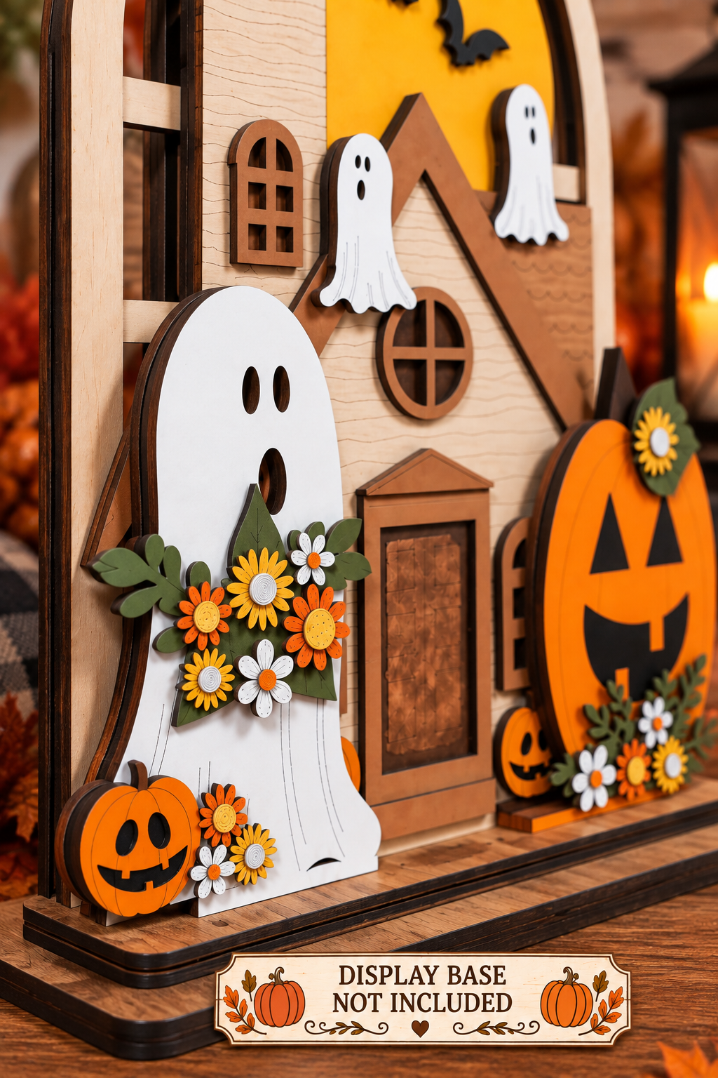 Angled close-up of Haunted Halloween interchangeable inserts showing layered wooden details