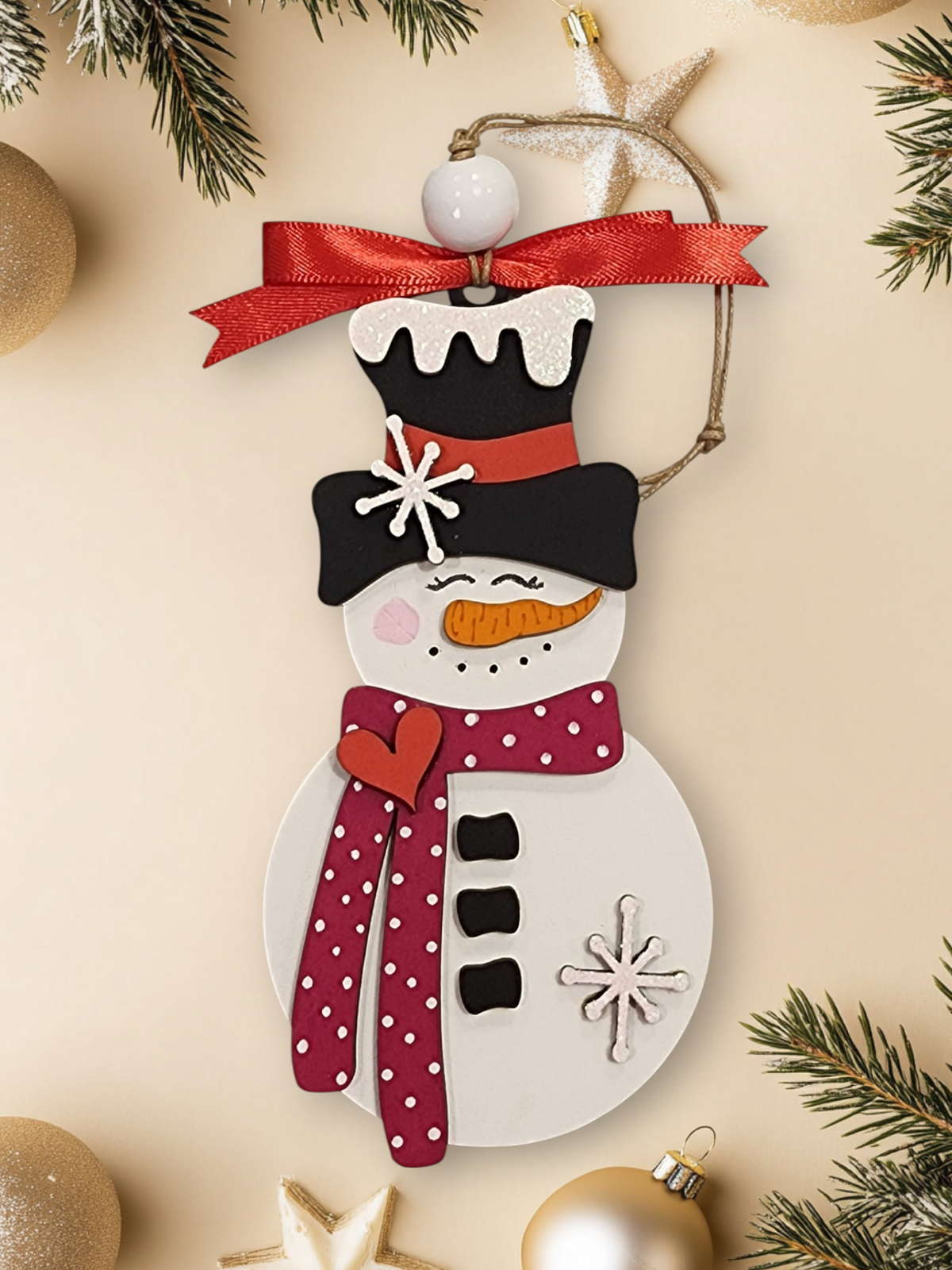 Whimsical layered wood snowman ornament with fuchsia polka dot scarf