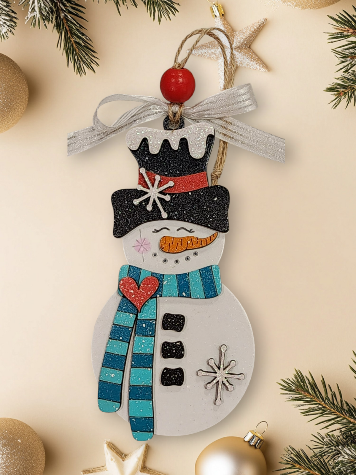 Whimsical layered wood snowman ornament with light and dark teal striped scarf
