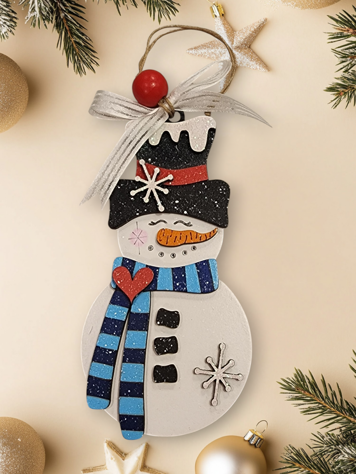 Whimsical layered wood snowman ornament with light and dark blue striped scarf