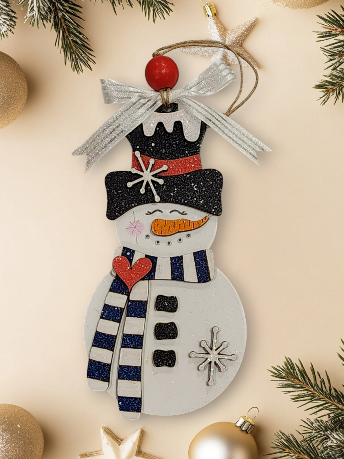 Whimsical layered wood snowman ornament with navy and white striped scarf