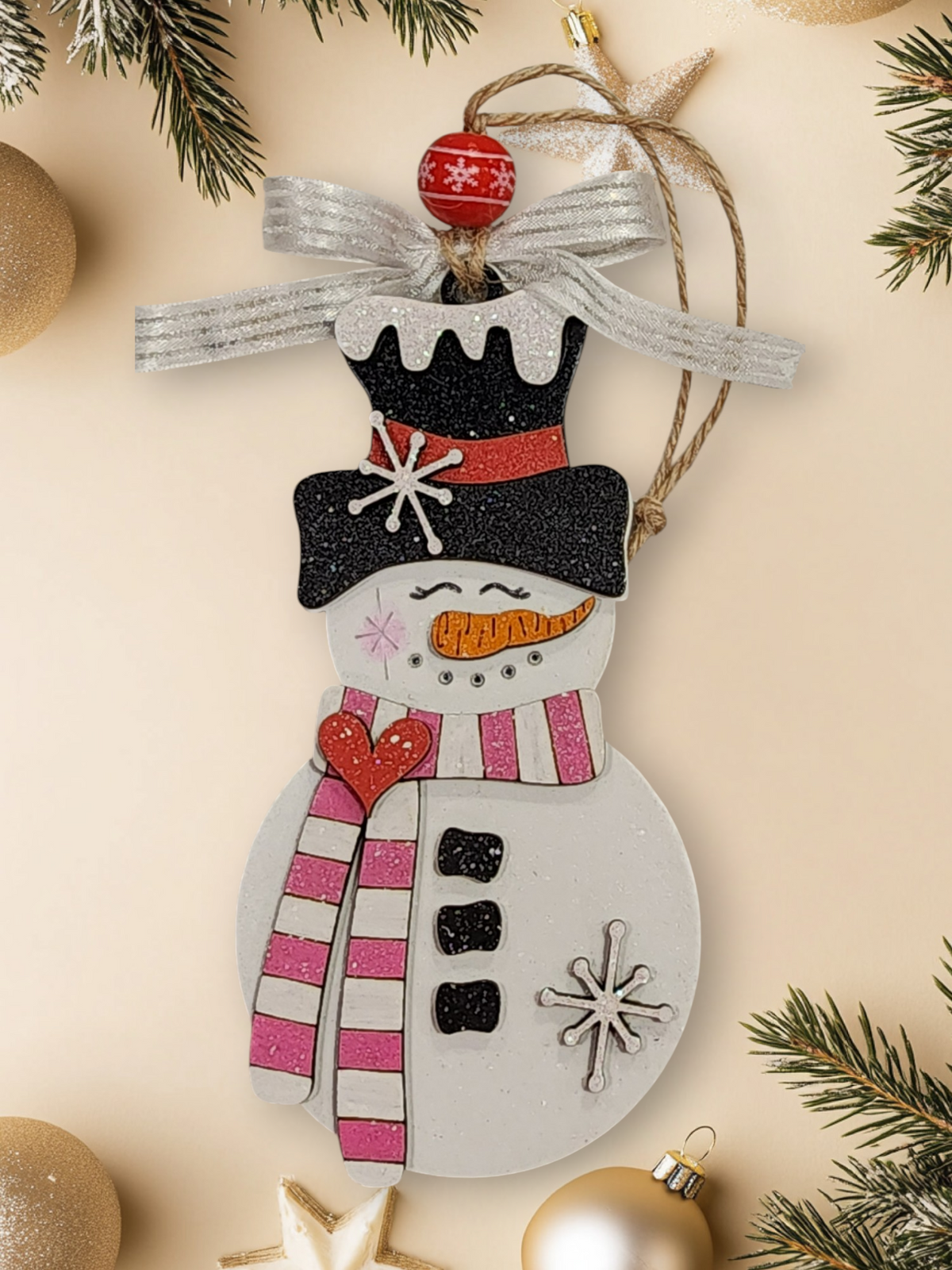 Whimsical layered wood snowman ornament with pink and white striped scarf